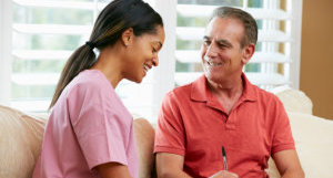 elderly man and caregiver